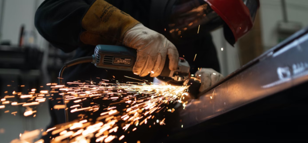 Person cutting metal